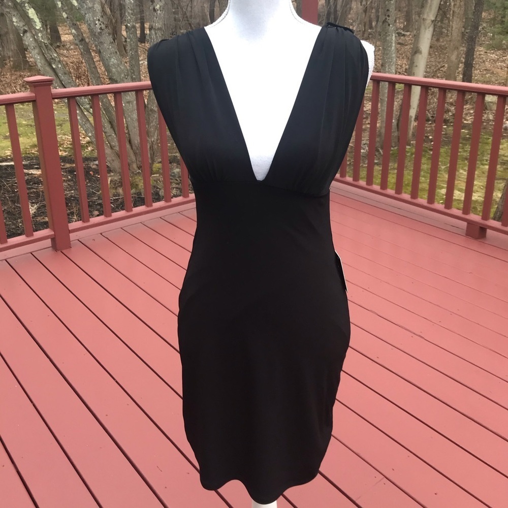 NWT! Express SP black dress with a deep v neck .